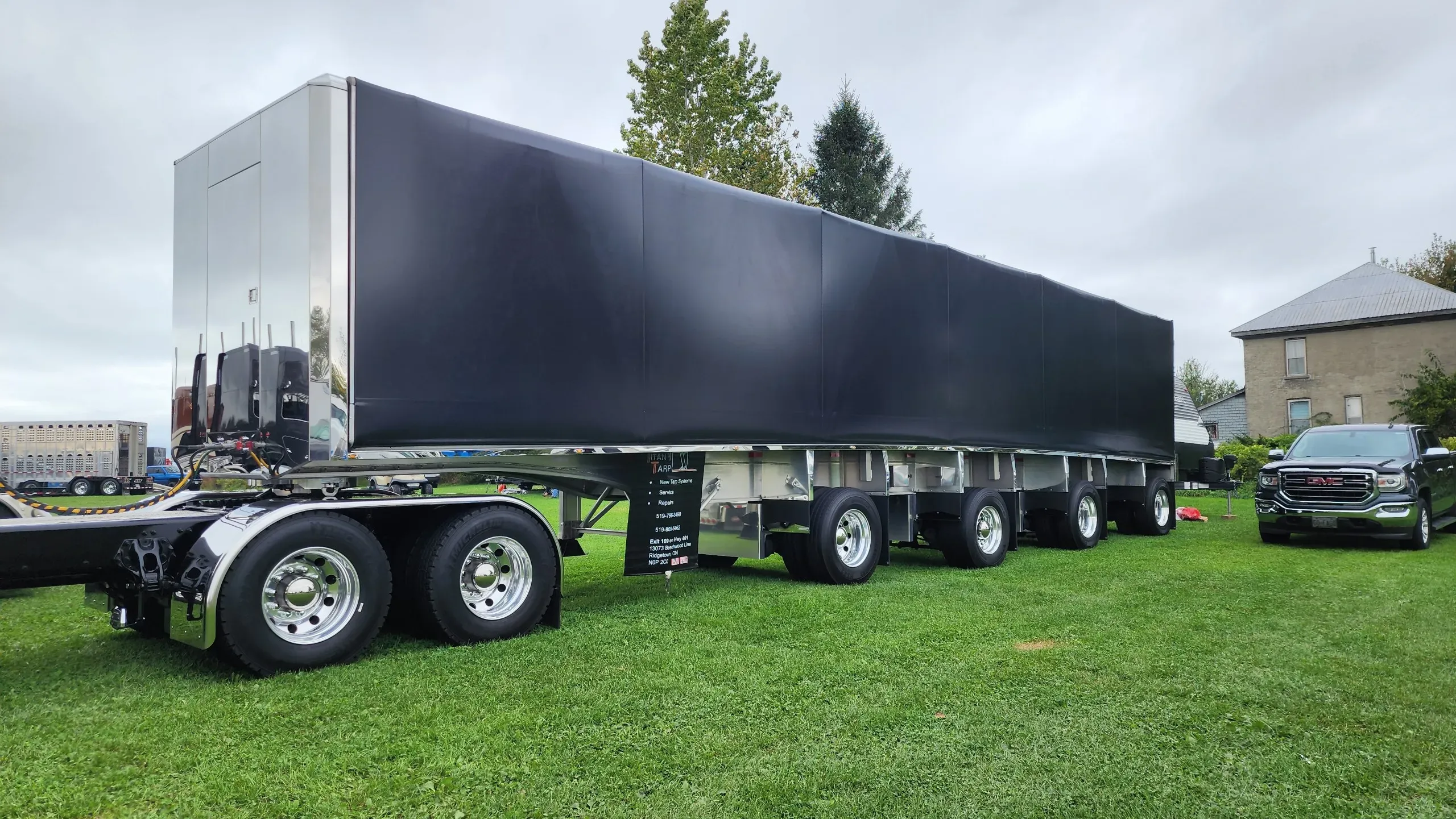 A Titan sliding tarp system on a flatbed trailer