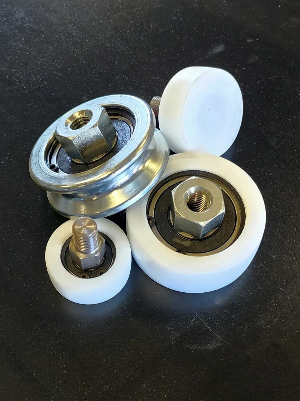 Close-up of tarp system wheels with their mounting hardware